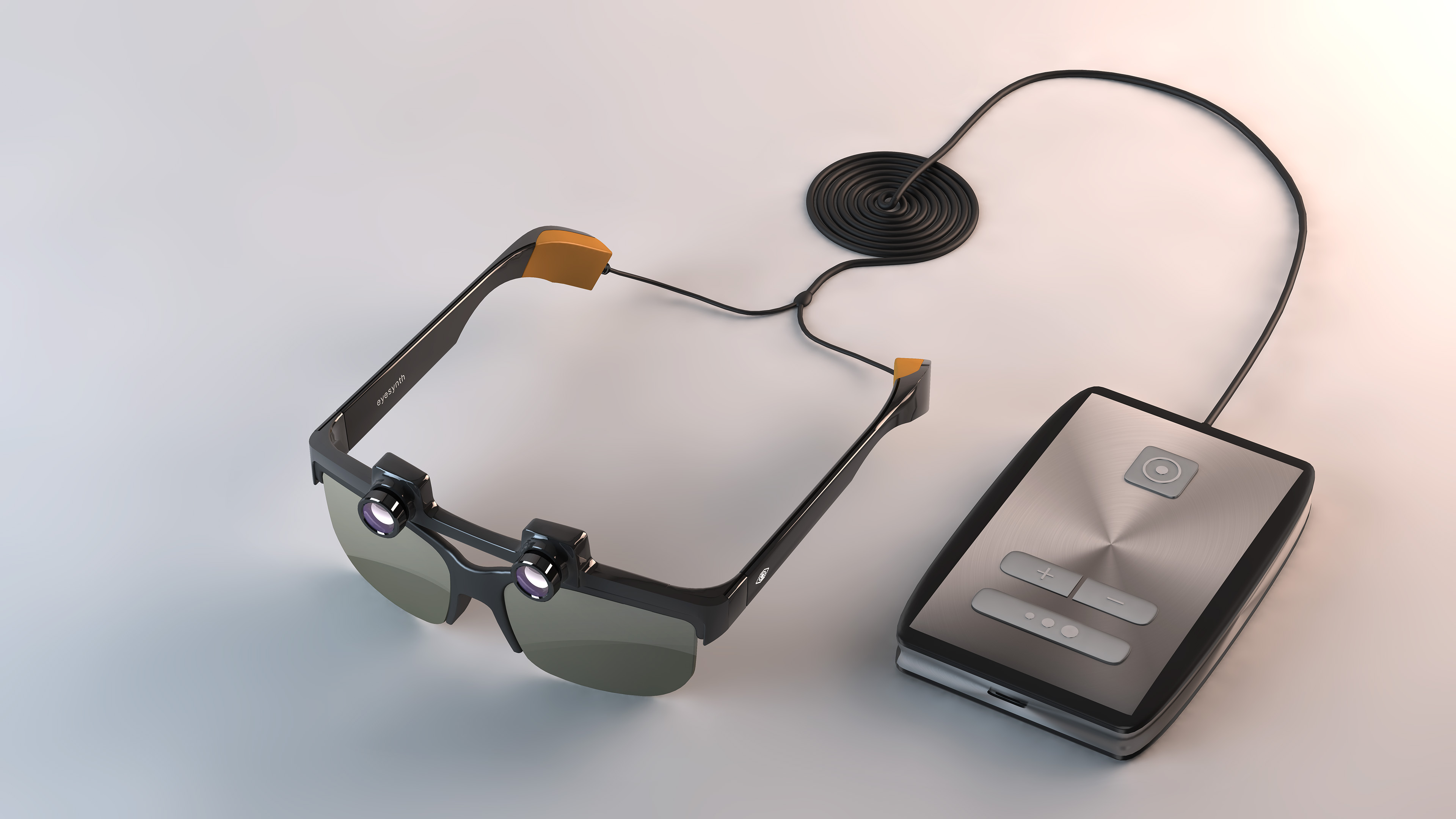Fotografía de los dispositivos de Eyesynth, las gafas y el pequeño ordenador