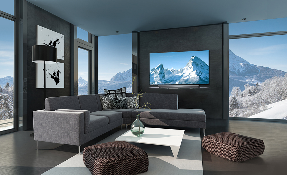 Un televisor LG OLED IA C8 en un salón cerca de las montañas